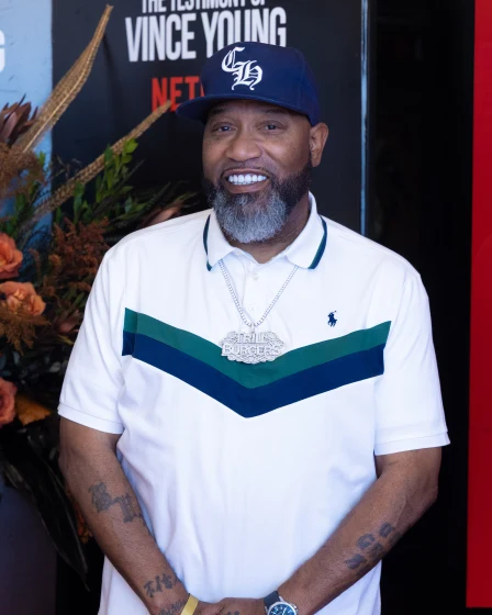 Guest on the orange carpet in front of the Netflix backdrop